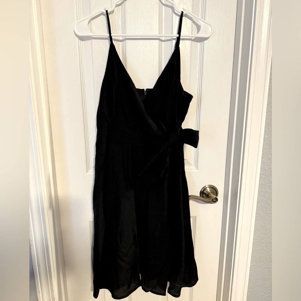 Side tie black dress. Ties on your left side, hard to see in photo.